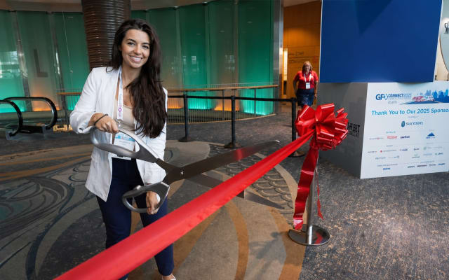 Nichole Osinski at GFX showcase floor ribbon cutting
