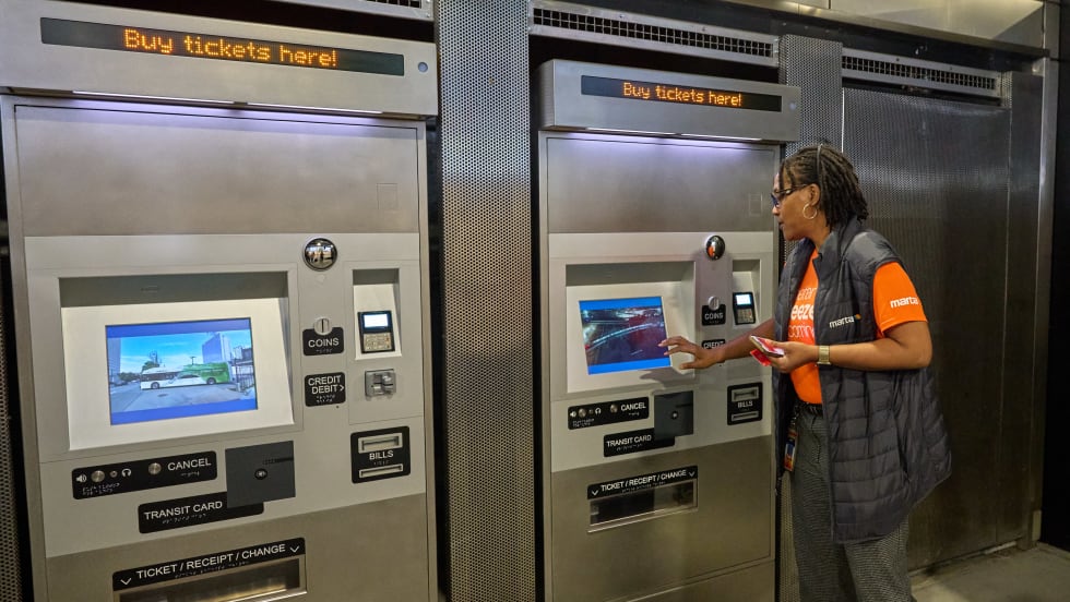 A MARTA employee using the new Better Breeze fare ticket machines.