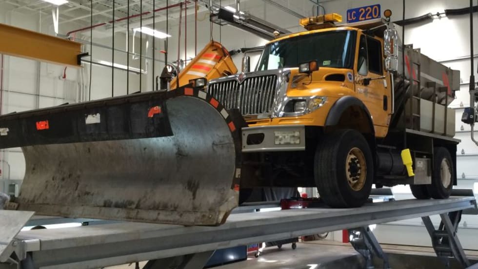 Stertil-Koni SKYLIFT-Washbay model lifts a Snow Plow