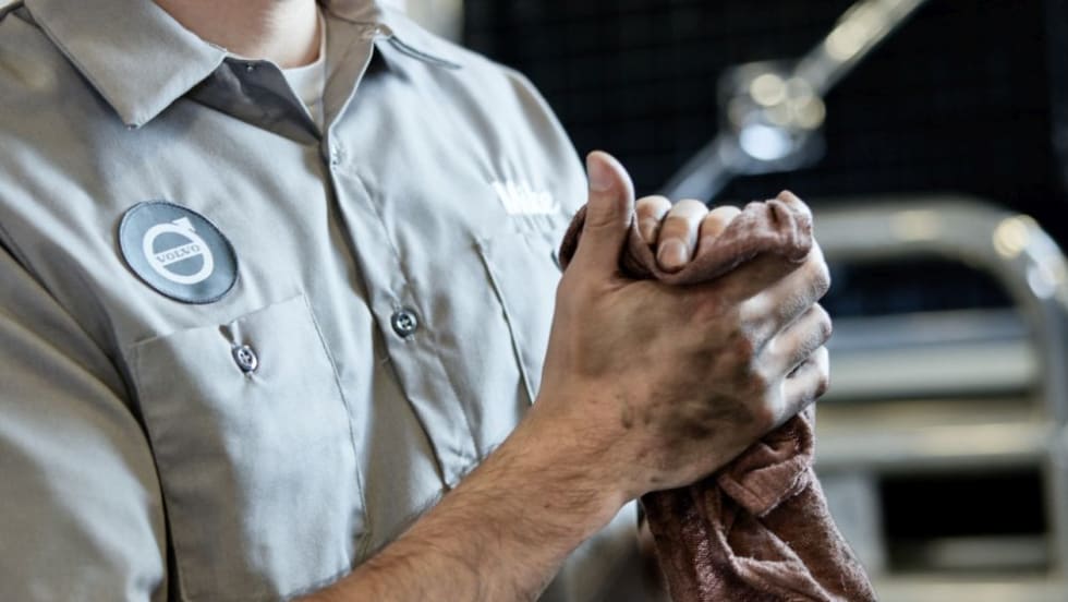 A technician with greasy hands and a rag.