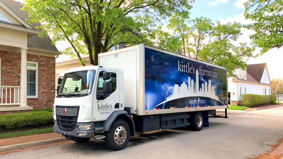 A Kenworth BEV with Kittle's Furniture branding equipped with a 282 kW battery pack.