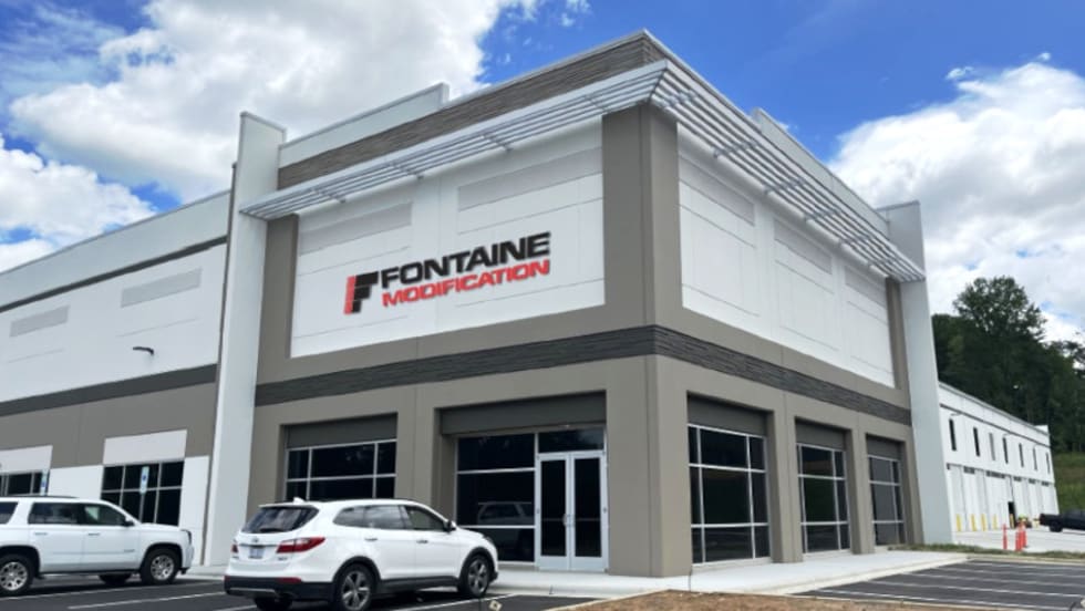 Photo shows a business building with the name Fontaine Modification above the entrance doors.