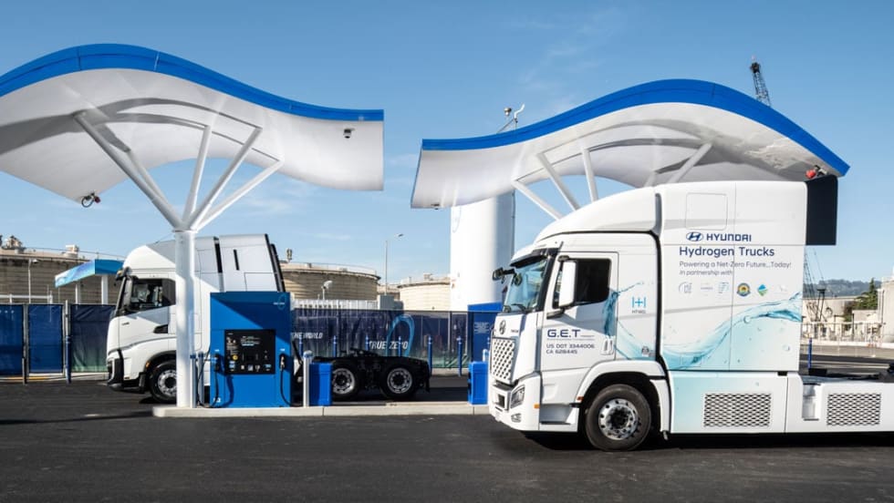 Hyundai Xcient Class 8 Fuel Cell Electric Trucks at hydrogen fueling station.