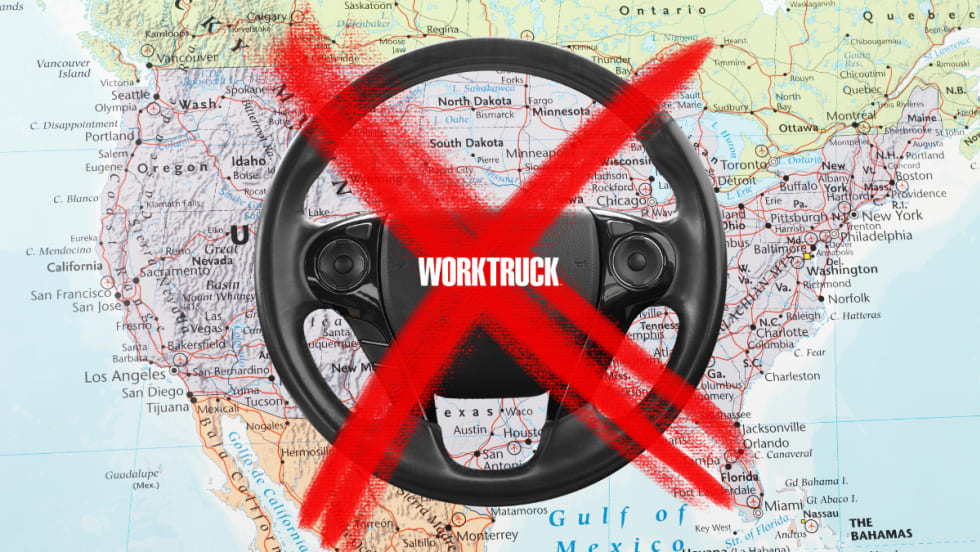 A map of the U.S. with a steering wheel and a red X over the steering wheel