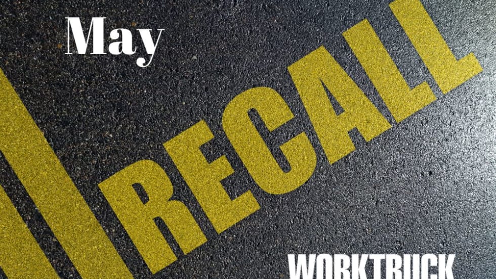 pavement background has Recall and yellow lines, with the month's date of May and the Work Truck logo.