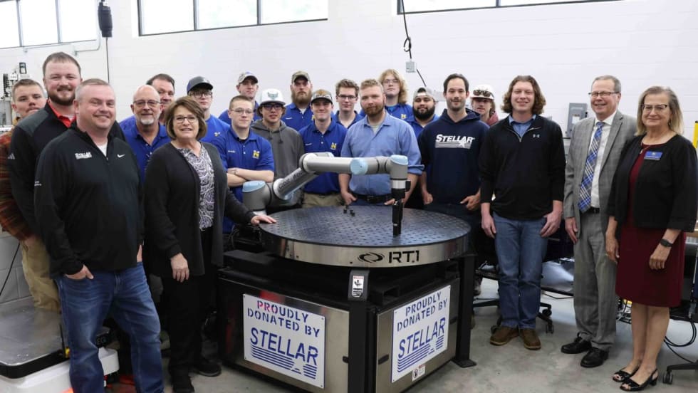 The Robotics team at North Iowa Area Community College pose with their new robot