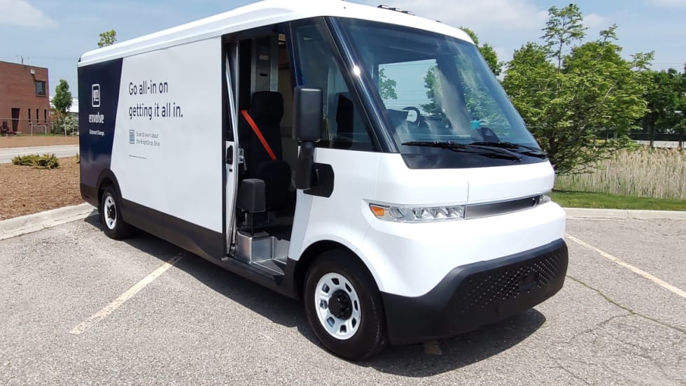 White EV cargo van is shown from the front quarter angle.