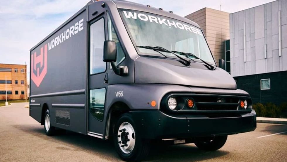 A black step van with Workhorse logo parked in a lot.