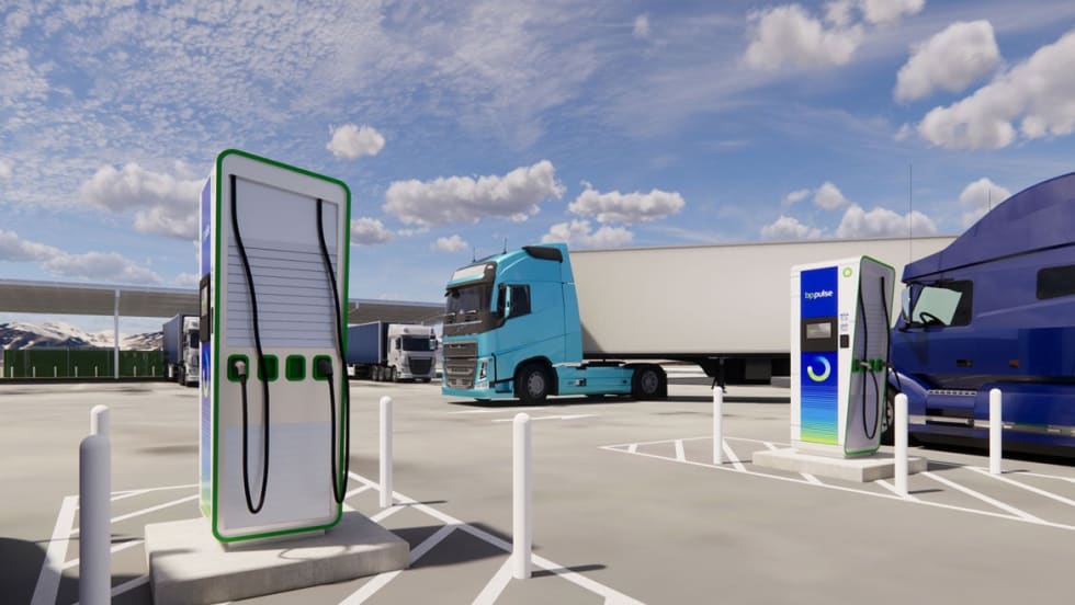 Electric-truck charging station with aqua cabover tractor-trailer in background