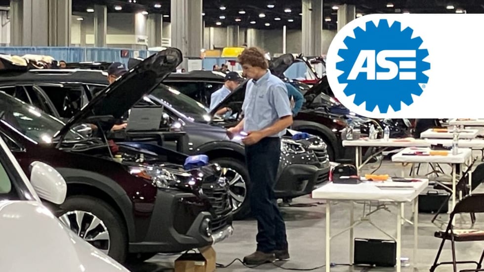 Male technician competes in auto repair.