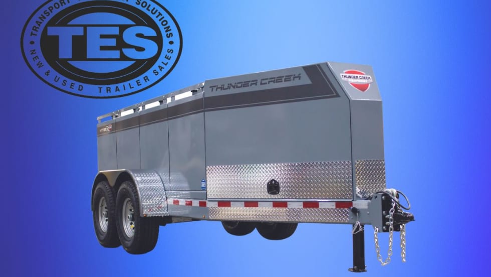 Metal tank trailer against a blue background with upper left logo for Transport Equipment Solutions. 