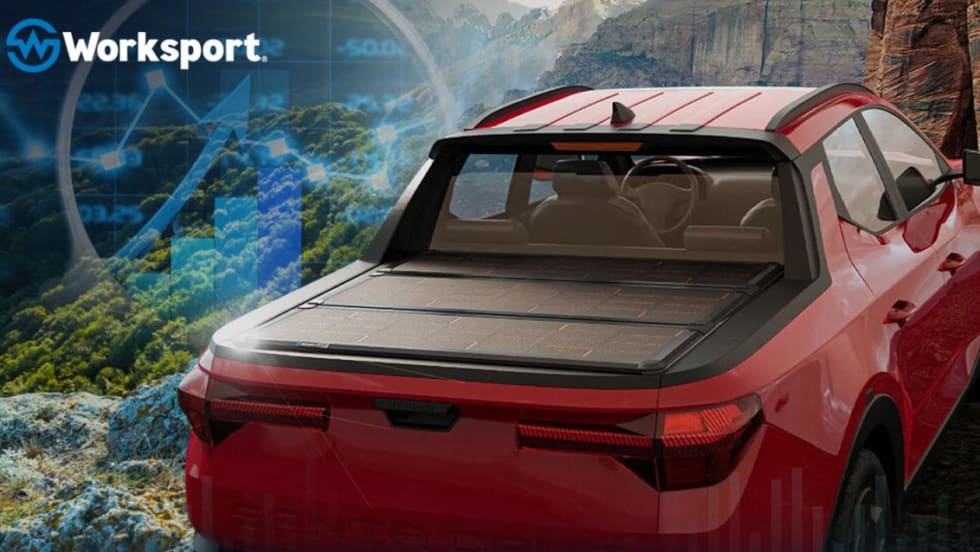 Red pickup truck with a tonneau cover with solar cells.