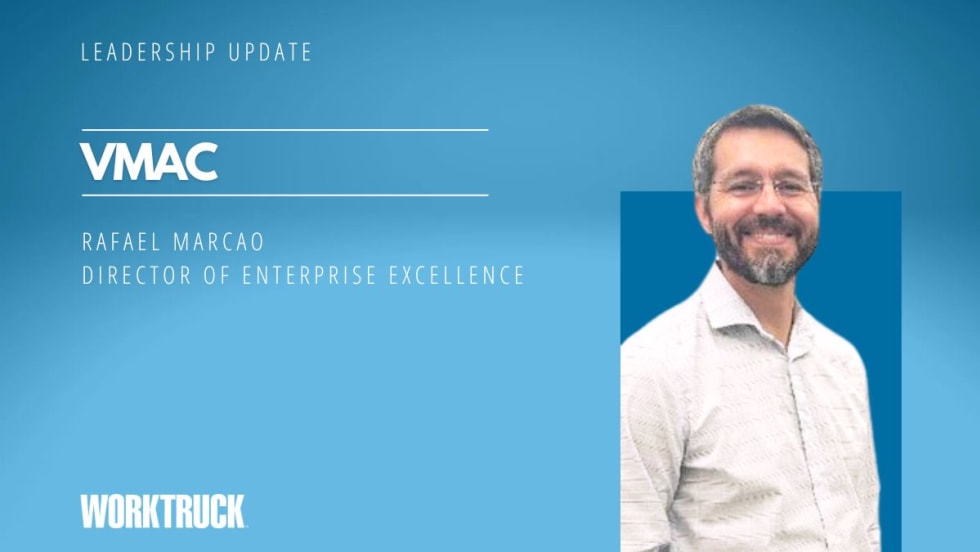 Business man on a blue background and company name of VMAC.