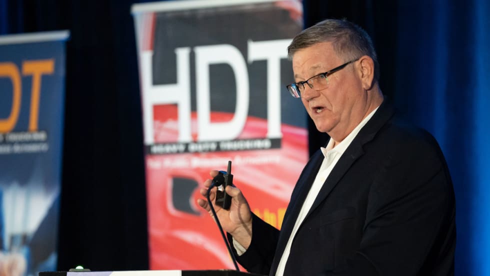 FMCSA former official Jack Van Steenburg at HDTX podium with HDT backkdrop