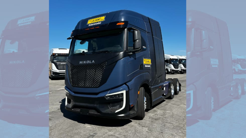 Dark blue European-style cabover tractor with J.B. Hunt logo
