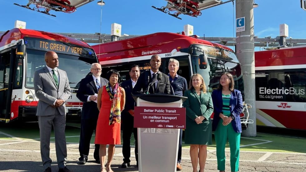 Toronto Transit Commission members unveiling new electric buses.