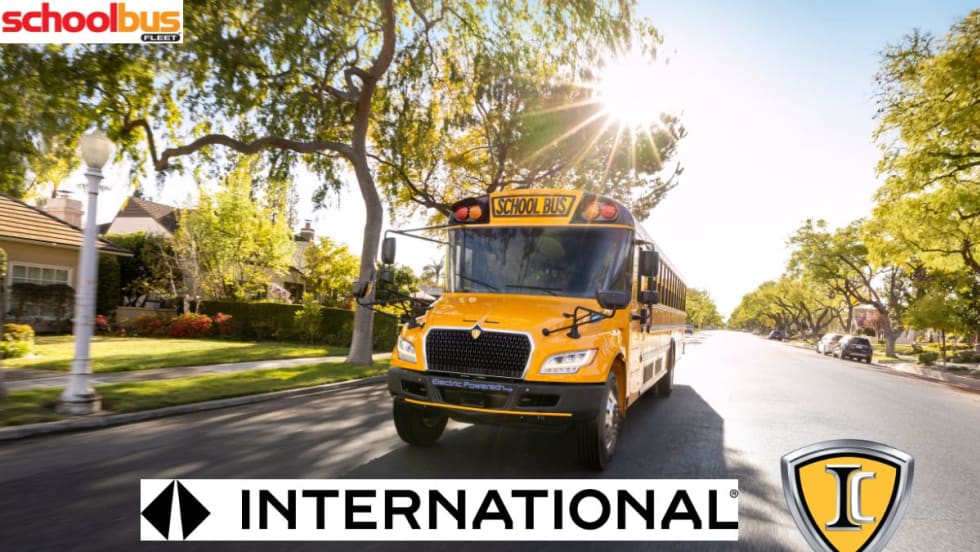 International's new logo in front of an IC bus driving down the road.