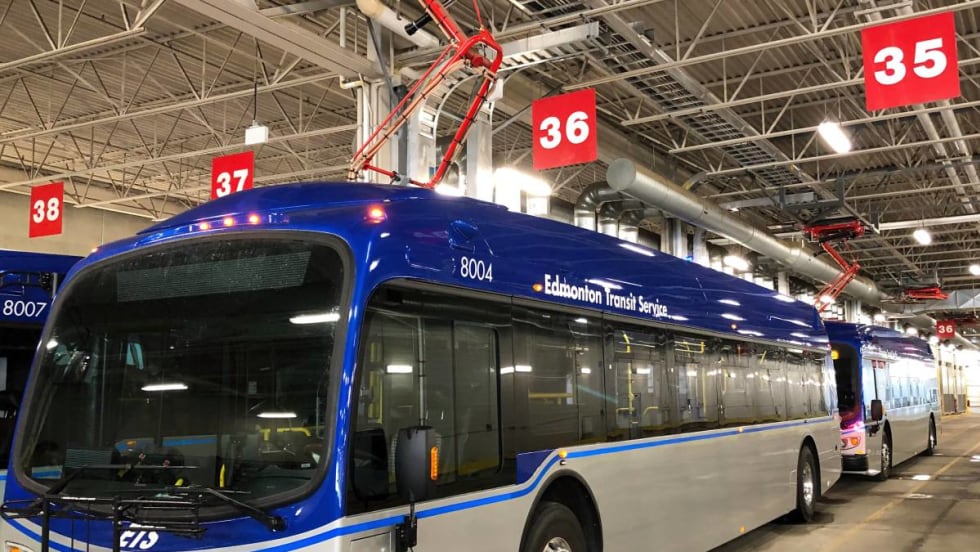 One of Edmonton's electric buses charging from an overhead charging station.