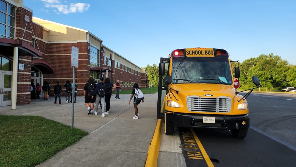 a school bus drops students off