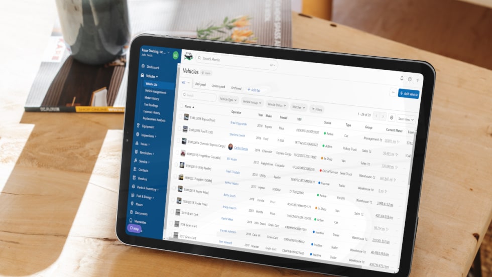 Tablet on desk with fleet management software on screen.