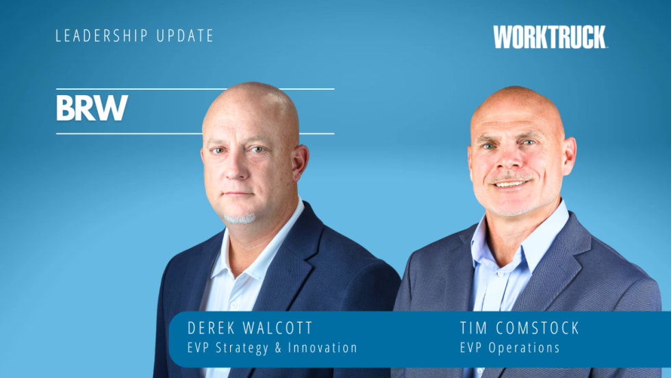 Two men in business attire in front of a blue background.