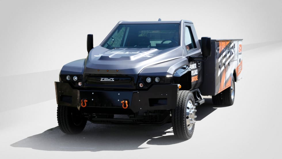 Medium-duty battery-electric truck with a service body.