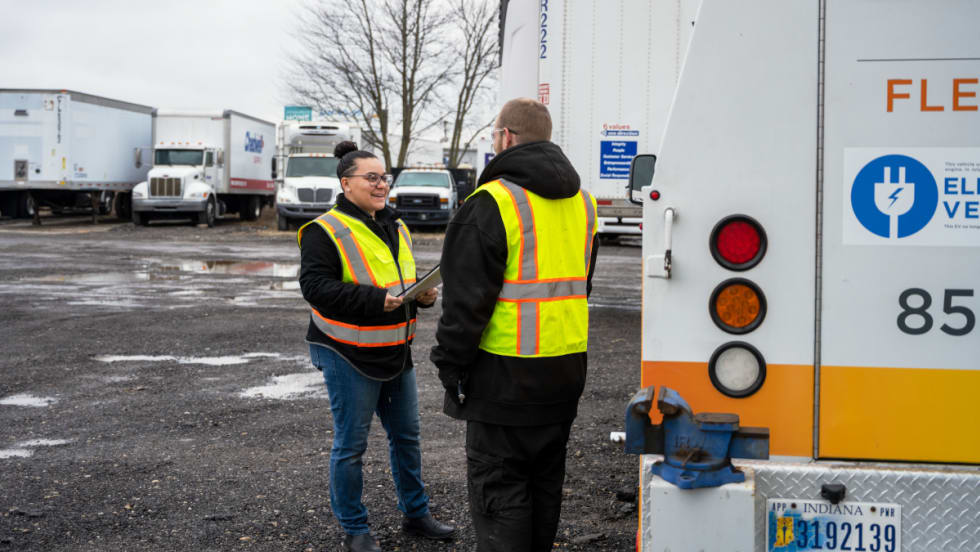 Two maintenance technician prepare a fleet for winter weather.