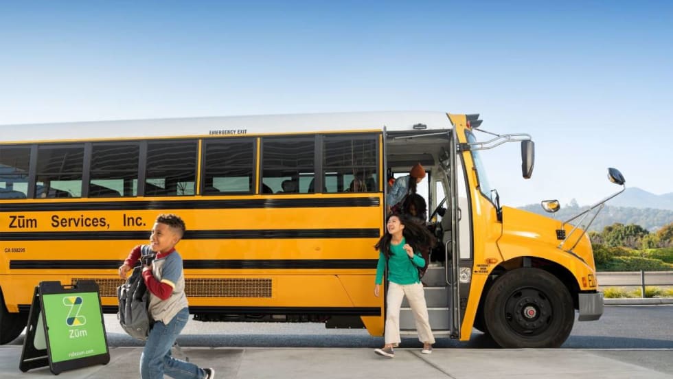 Children exiting a Zum bus.