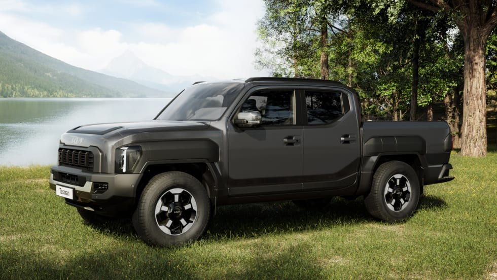 side view of compact pickup truck by a lake