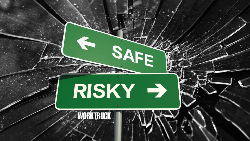 Sign showing safe one way and risky the other on broken glass background.