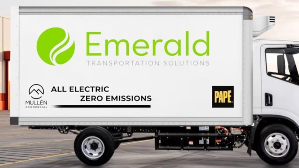 Side view of a white EV box truck