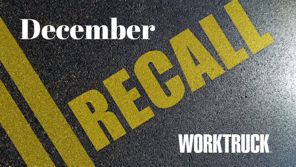 Image of asphalt with double yellow line, RECALL in yellow text, December and Work Truck in white text.
