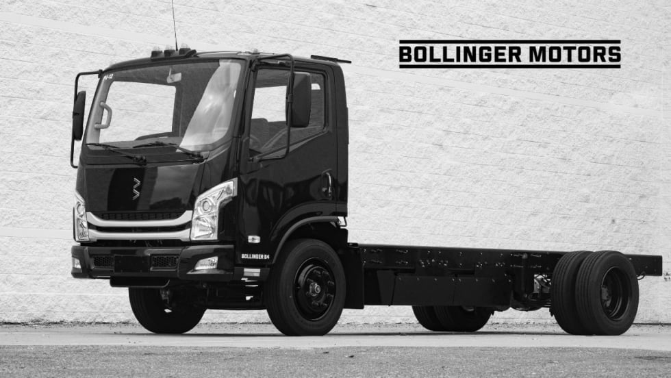 Chassis cab electric truck with Bollinger Motors logo on the background.