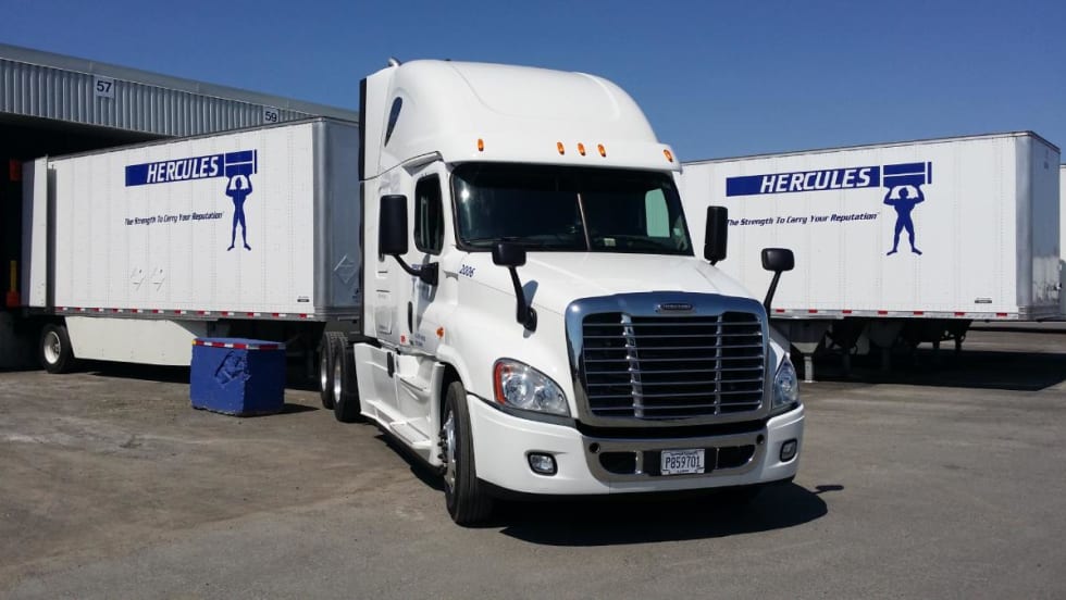 White tractor-trailers with Hercules logo