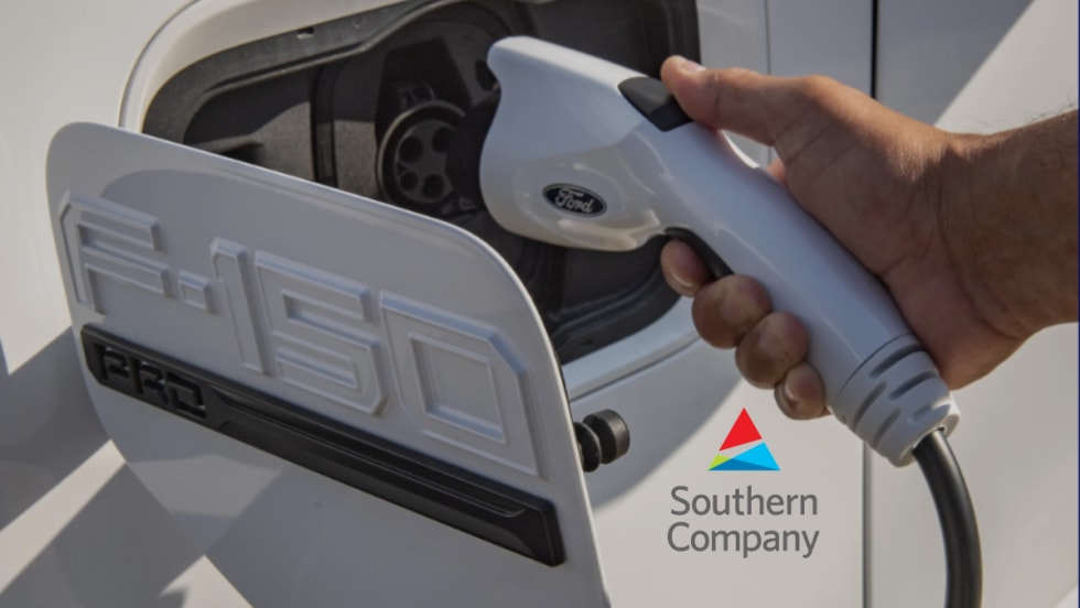 A Ford F-150 Lightning being charged with Southern Company logo