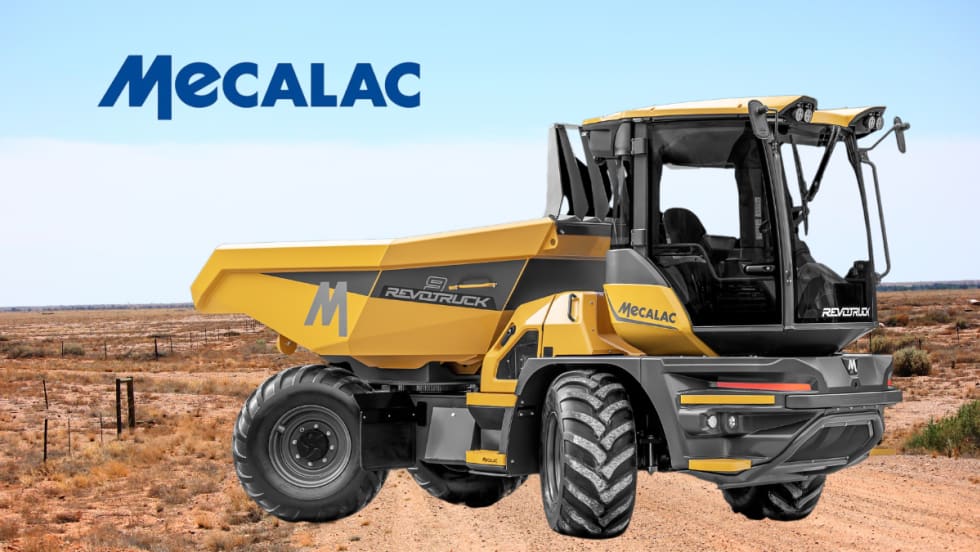 Yellow jobsite dump truck against a dirt road background.
