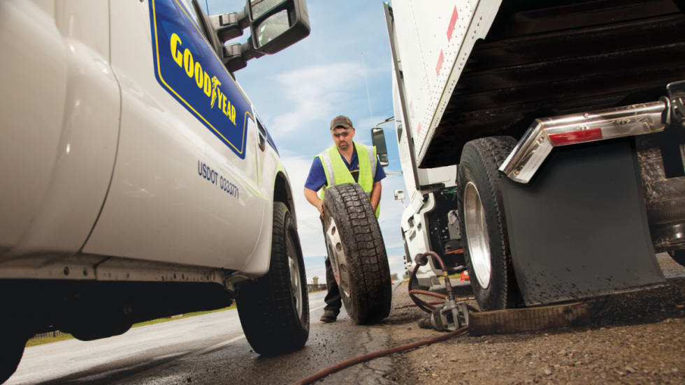 Maintenance tech working on tire for Goodyear Fleet HQ