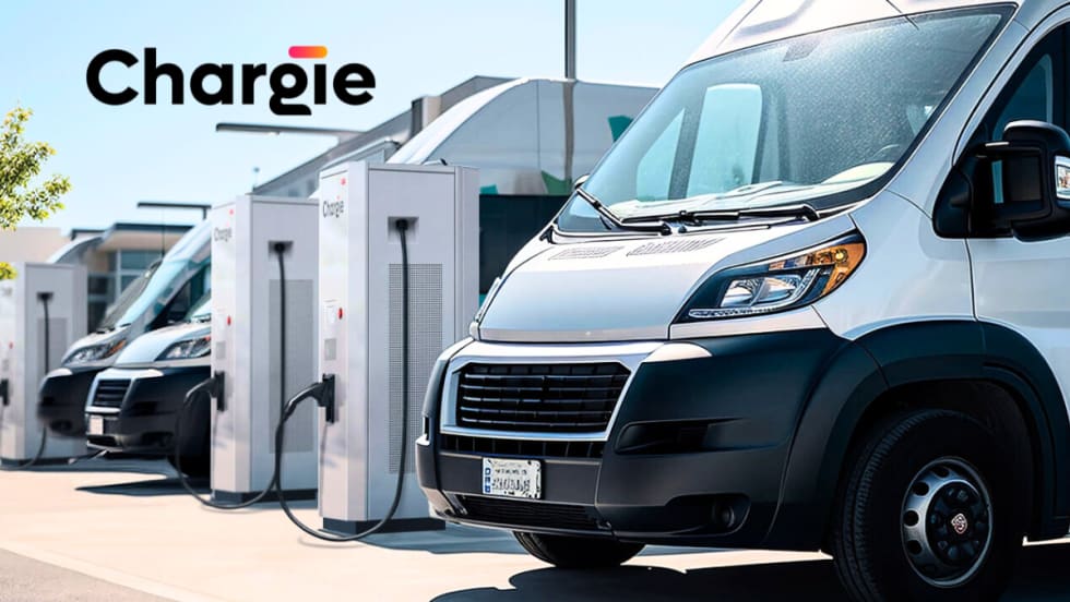 White electric vans plugged in for charging, company logo for Chargie in the upper left of the image.