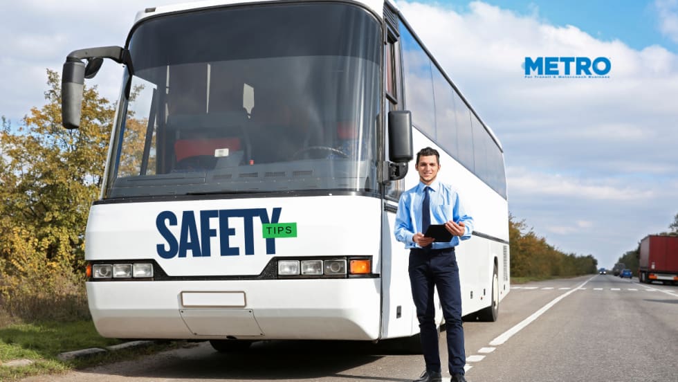 Bus driver standing in front of a bus