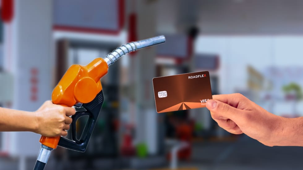 image of a fuel dispensing handle at a pump and a hand holding a fuel card.