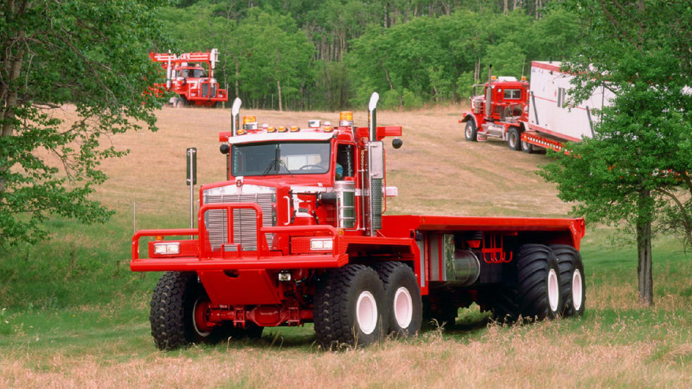 An older classic Kenworth straight truck working offroad.