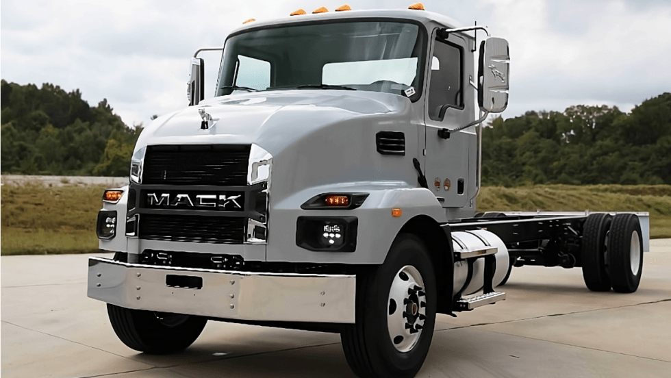 Gray chassis cab Mack truck parked.