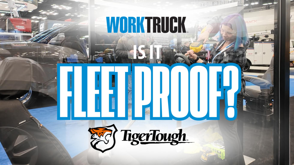 Lauren Fletcher tests Tiger Tough seat covers with weed whacker at Work Truck Week 2025