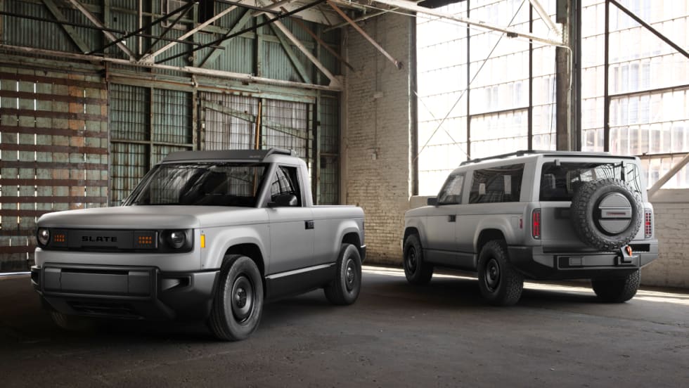 Image of gray compact pickup truck and SUV parked in an old warehouse.