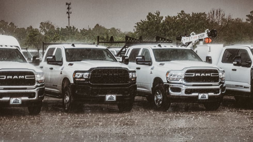 Pickup trucks in the rain