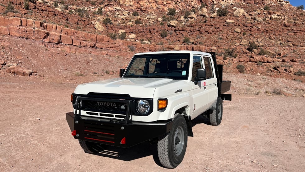 White Toyota Land Cruiser in an offroad environment.