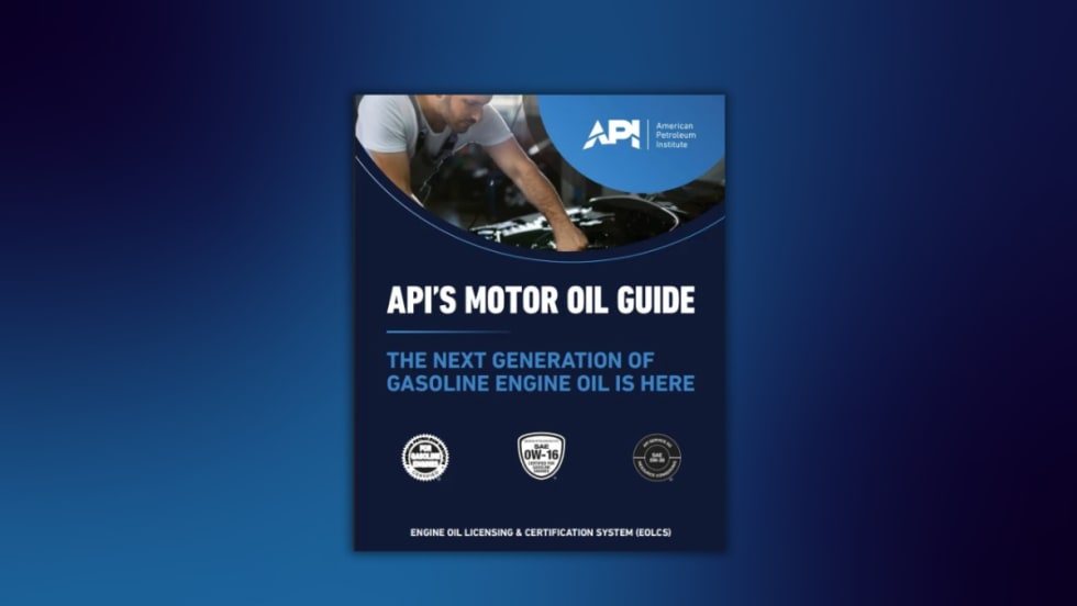 Cover of API's Motor Oil Guide featuring a mechanic working under the hood of a car, with text stating "The Next Generation of Gasoline Engine Oil Is Here" and API certification symbols for gasoline. 
