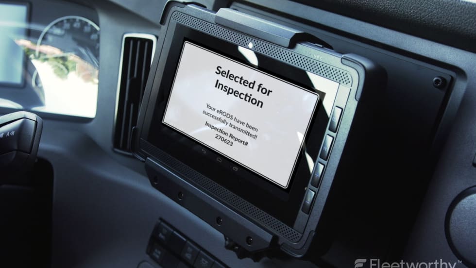 Information displayed on an ELD inside a commercial truck cab.