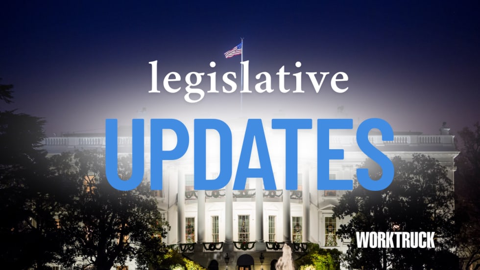 White House at night with U.S. flag and trees in foreground, overlaid with the text "Legislative Updates" and "Work Truck" logo in lower corner.
