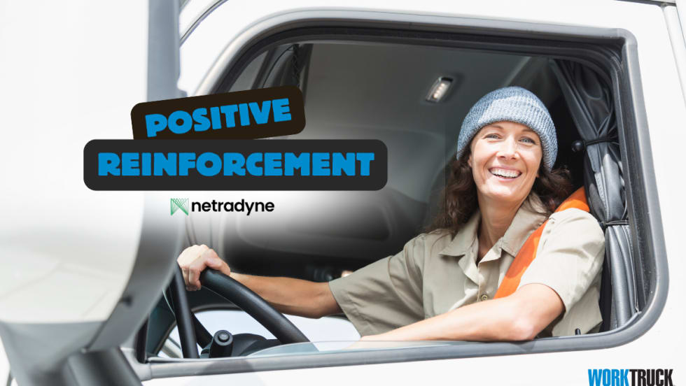Smiling truck driver in cab, highlighting Netradyne’s DriverStar program promoting safety through positive reinforcement and real-time driver recognition.